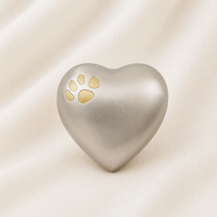 Silver Heart Shaped Pet Urn with Gold Paw Inlay Image 1